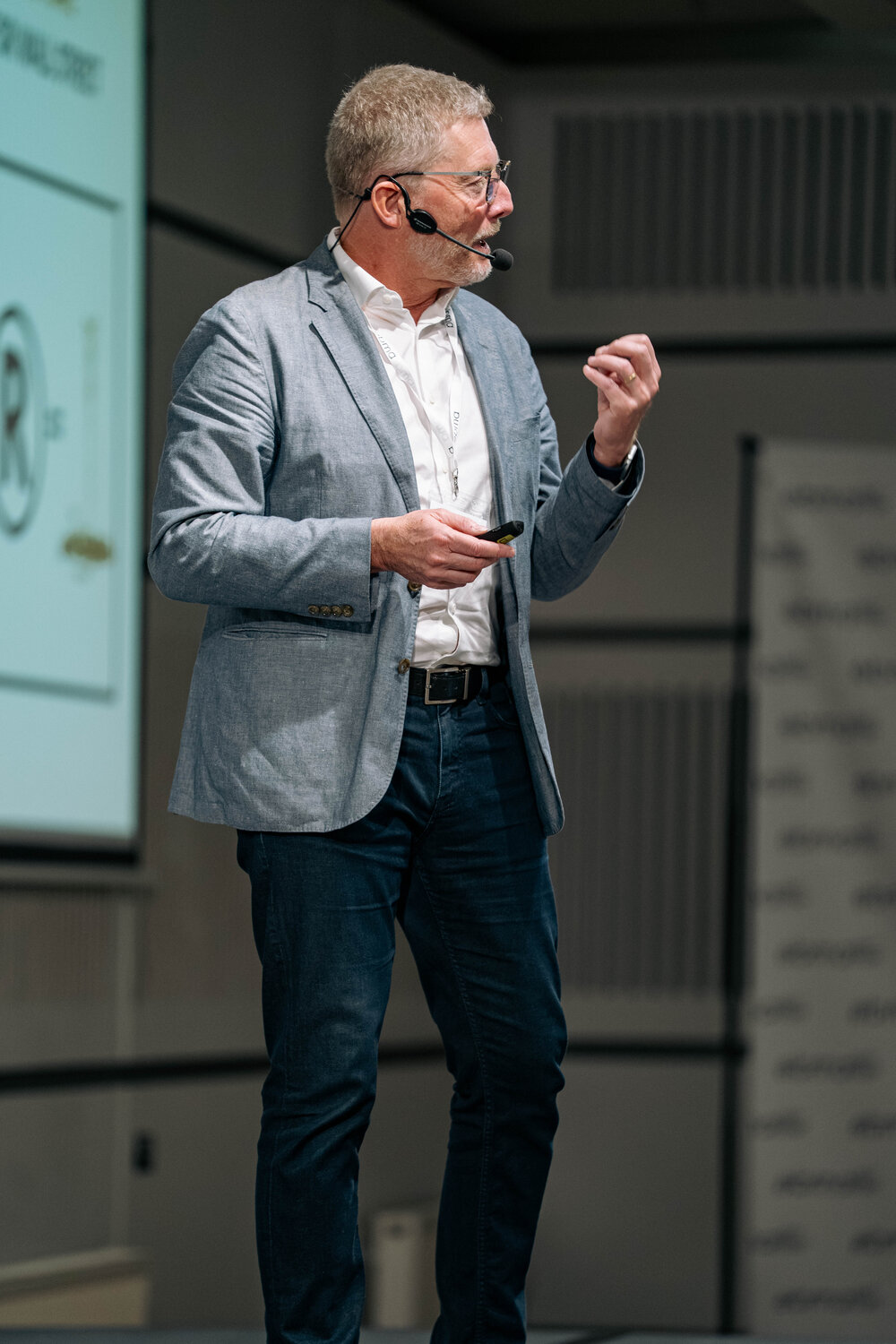 Chris Burggraeve presenting with a headset microphone